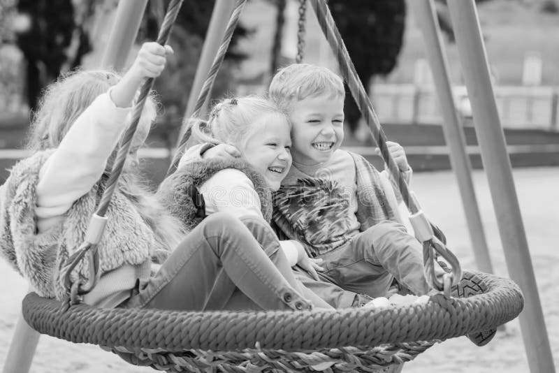 Three Children Playing Park Swing Black White 137044797 1505095260